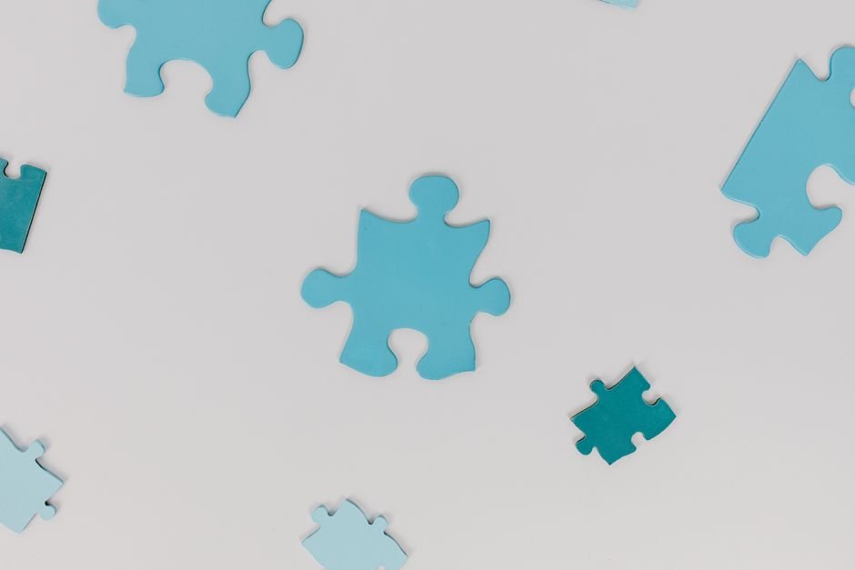 Scattered puzzle pieces illustrating a strategy that fits historical data too perfectly