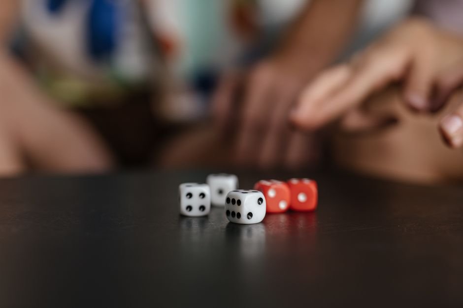 Dice rolling on a table, a nod to random resampling in Monte Carlo simulation