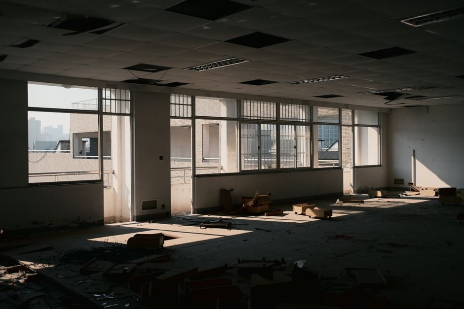 Abandoned empty office floor, a reminder of the companies missing from survivor-only datasets